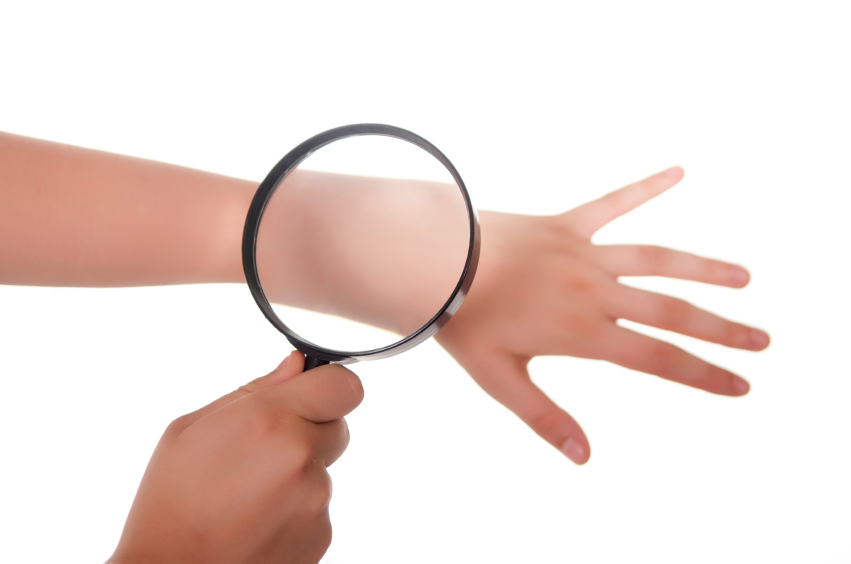 Image of a magnifying glass on an arm.